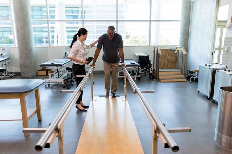 Patient in rehabilitation center trying to walk