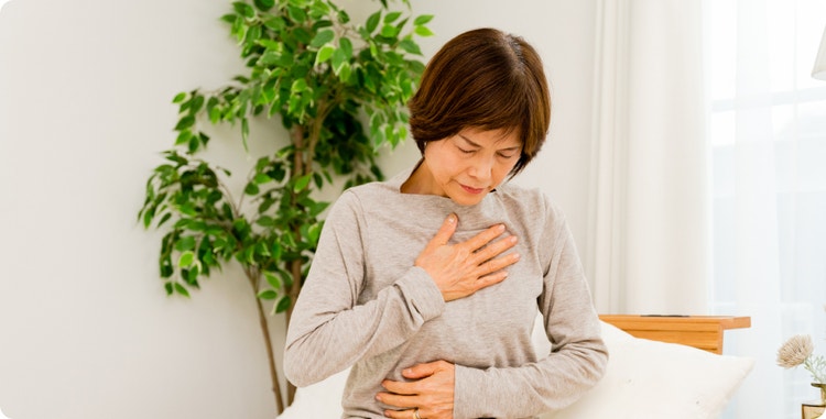 Woman with her hand over her heart